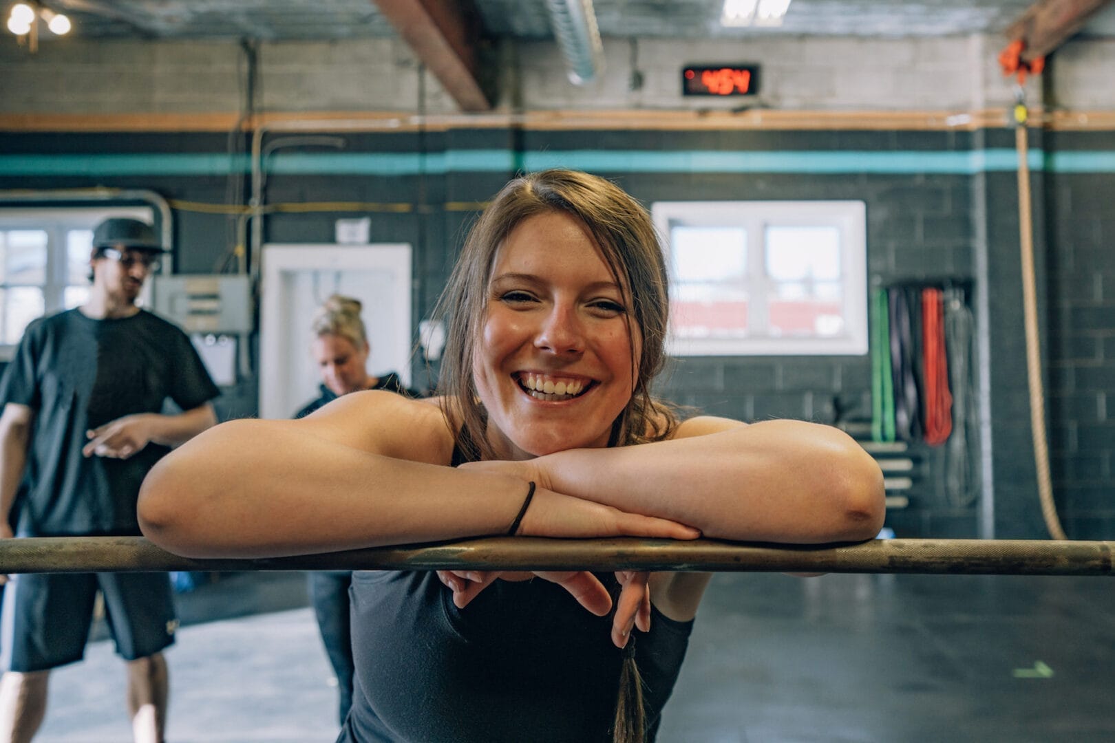 smiling woman weightlifting